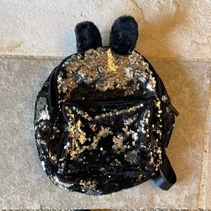 Girl’s back sequin back pack with faux fur ears. Like new two pockets